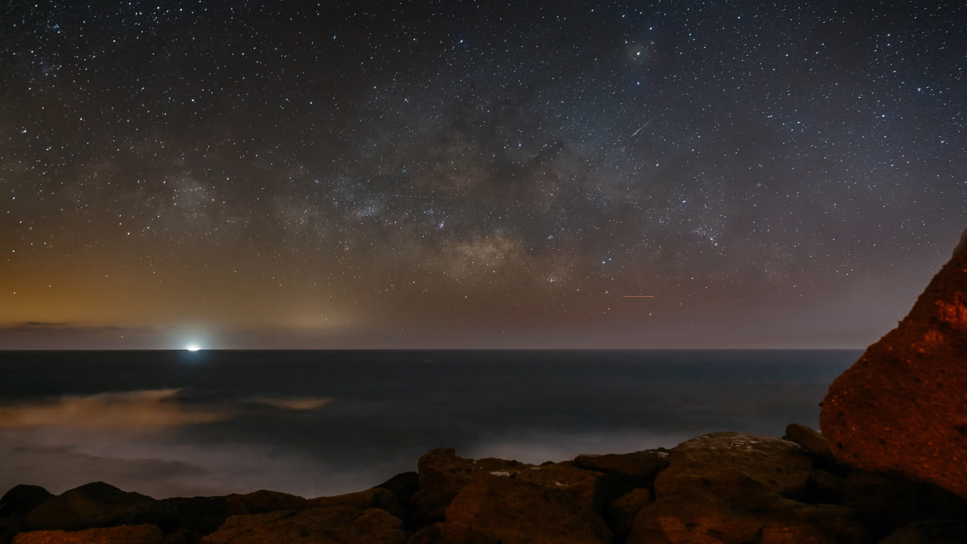 4K Timelapse of Milky Way rising above the ocean