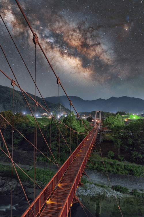 The galaxy over a red bridge