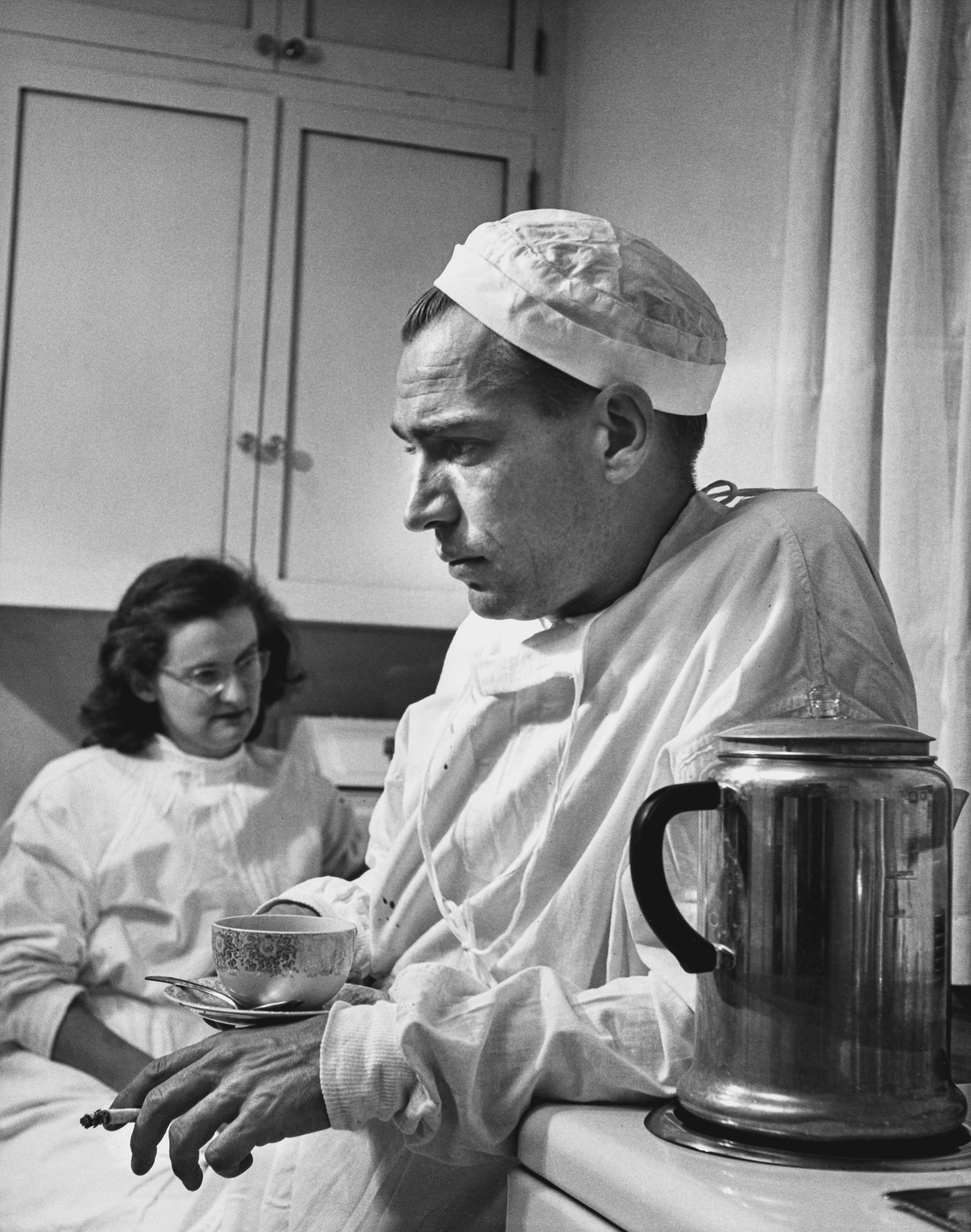 Country Doctor - Dr. Ernest Ceriani with Coffee, Cigarette, and Nurse in Hospital Kitchen