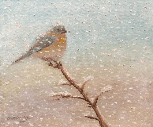 Bird under the snowfall