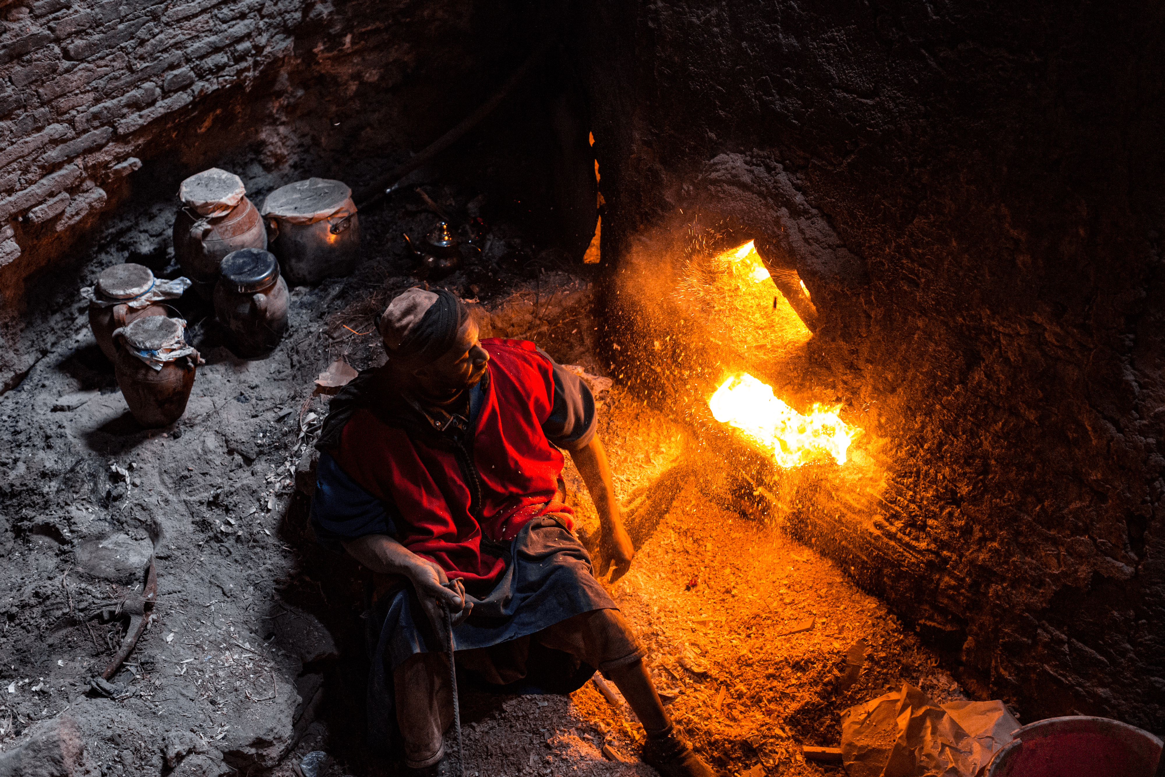 The Gnaoua feeding the hammam furnace in Marrakech, Morocco