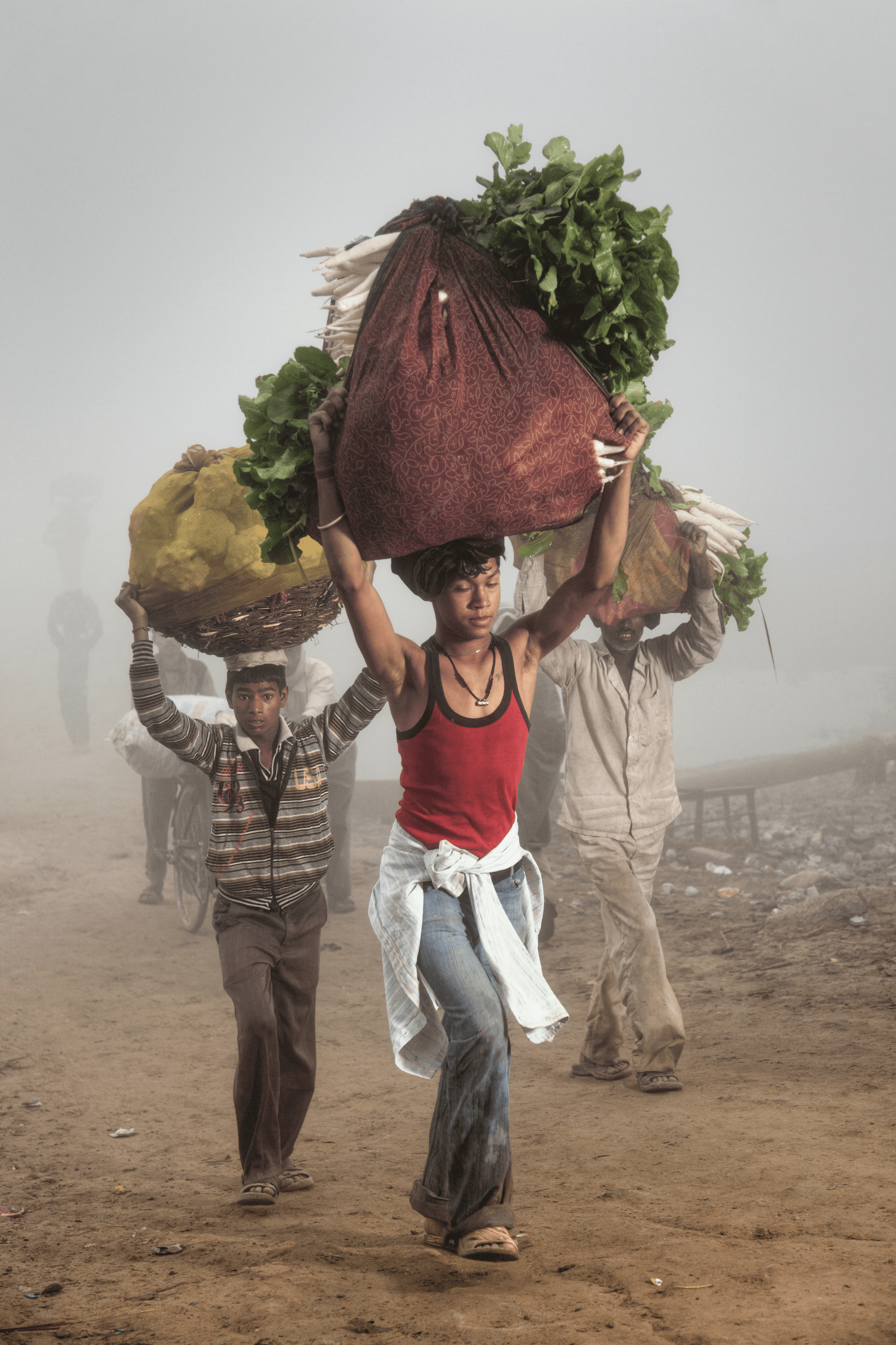 Men carrying vegetables; at the Yamuna River, Uttar Pradesh #2/8