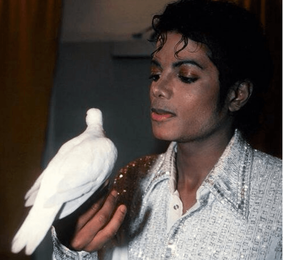 Michael Jackson holding a huge pair of underwear with doves on his hands.  Circa 1985. : r/OldSchoolCool
