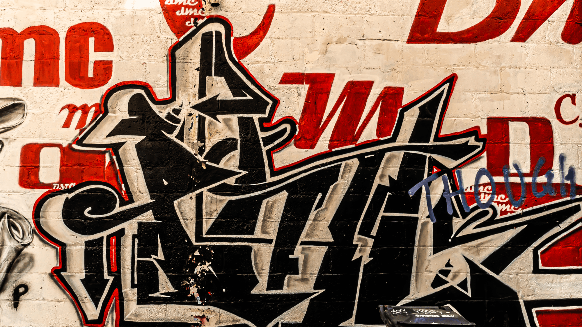 Beautiful graffiti Toronto wall with black and red spray paint - SEBAT