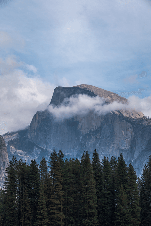Fog passing in front of Half Dome