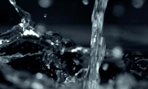Slow motion rain drops close up