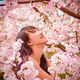 beautiful woman with sakura blossoms
