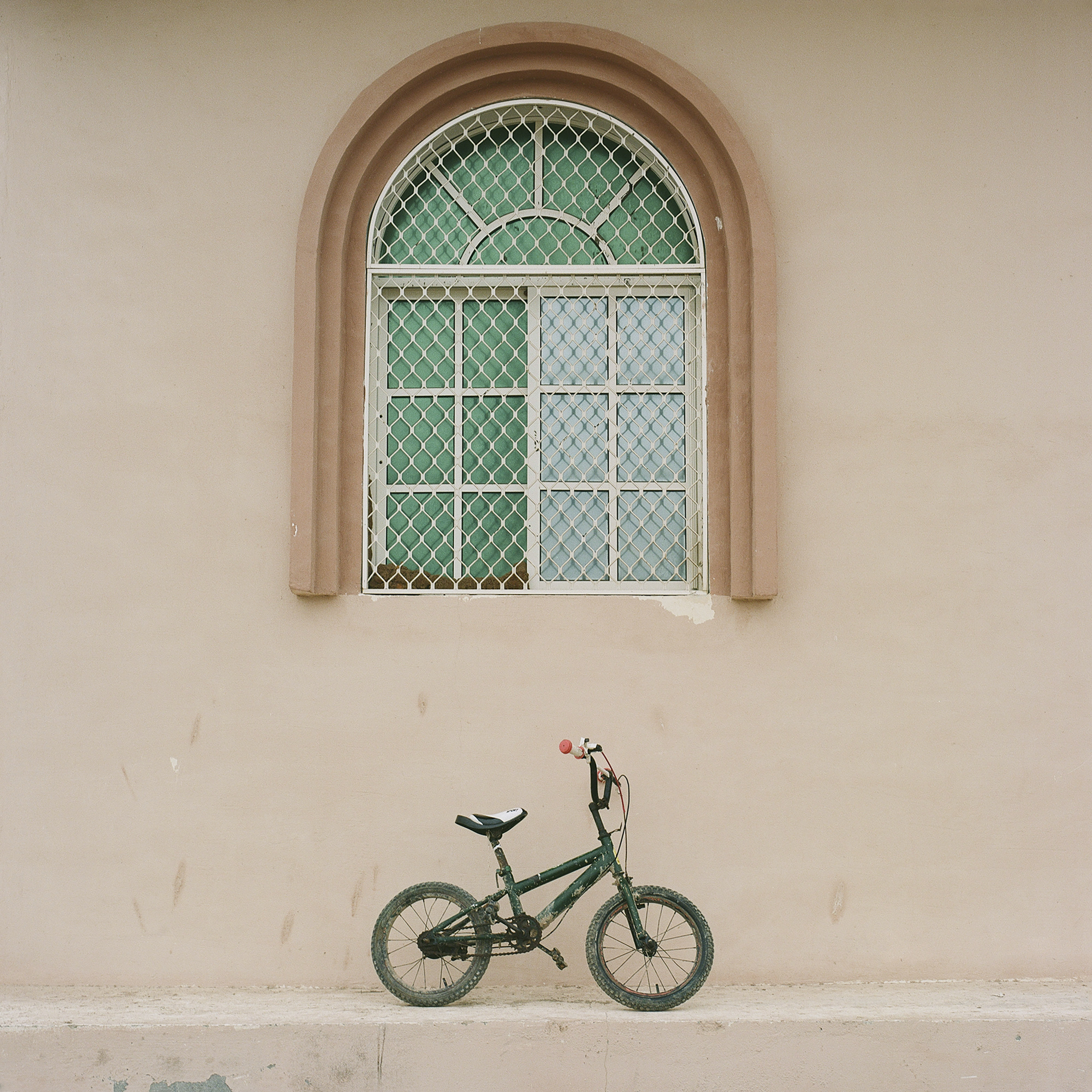 Bicycle Underneath Window.