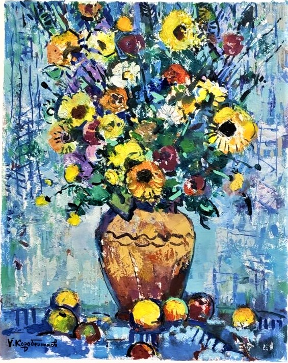 Flowers in a vase with fruit