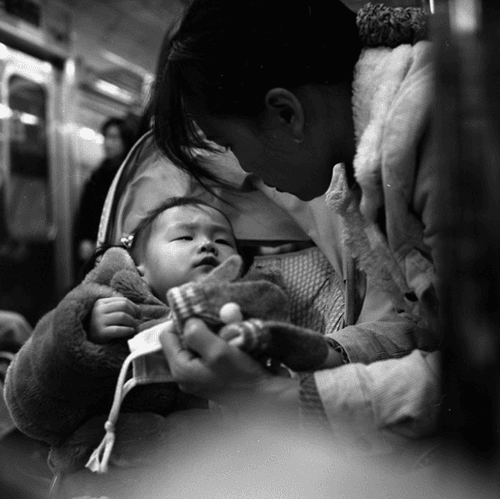 a subway mother and child