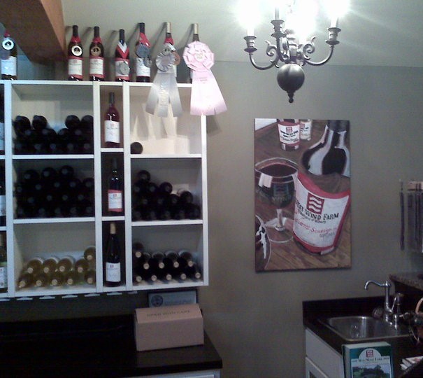 West Wind Winery business/logo art on display in tasting room